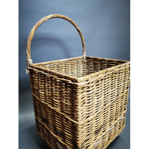 164 - Early 20th C. wicker log basket on wheels {96 cm H x 54 cm W x 44 cm D}.
