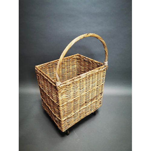 164 - Early 20th C. wicker log basket on wheels {96 cm H x 54 cm W x 44 cm D}.