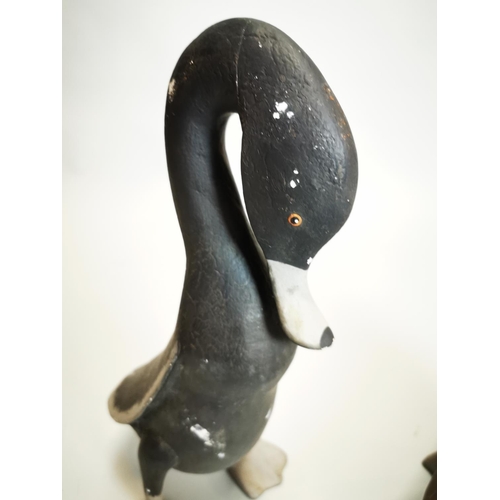 17 - Pair of decorative hand painted metal ducks {38 cm H and 24 cm H}.