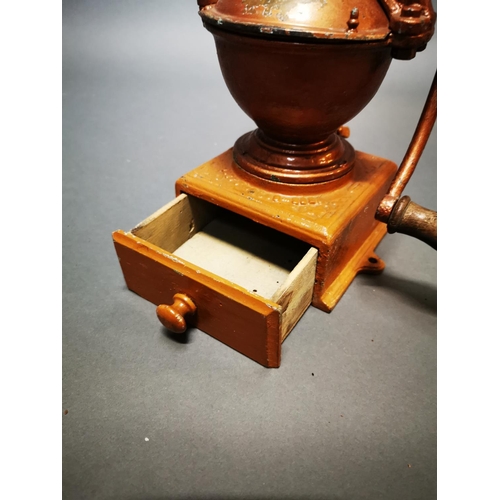 170 - Early 20th C. cast iron and brass coffee grinder {30 cm H x 19 cm W x 15 cm D}.