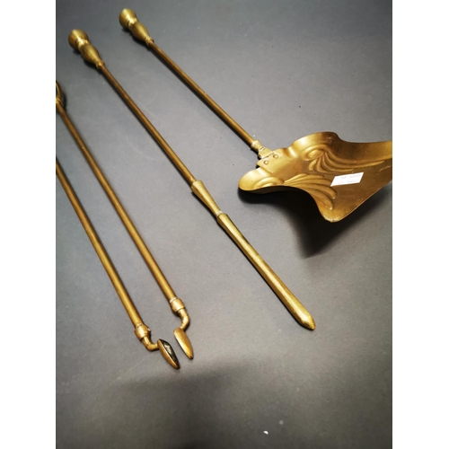 171 - Set of three Victorian brass fire irons {70 cm H}.