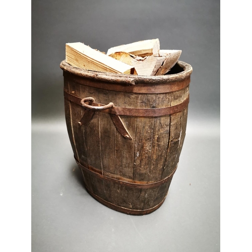 241 - Early 20th C. metal bound log bucket with wrought iron handle {59 cm H x 47 cm W x 46 cm D}.