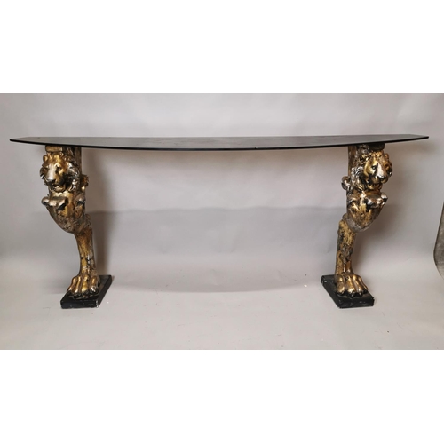 244 - Good quality glass console table raised on composition lions supports {84 cm H x 200 cm W x 40 cm D}... 