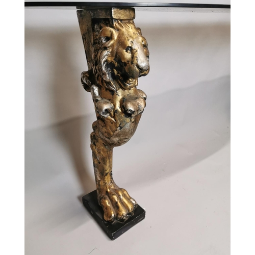 244 - Good quality glass console table raised on composition lions supports {84 cm H x 200 cm W x 40 cm D}... 