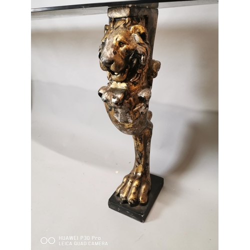 244 - Good quality glass console table raised on composition lions supports {84 cm H x 200 cm W x 40 cm D}... 