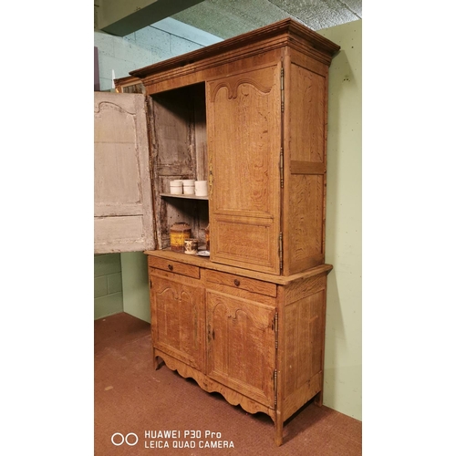 255 - Early 19th C. bleached oak two piece kitchen cupboard two long panelled doors over two short drawers... 