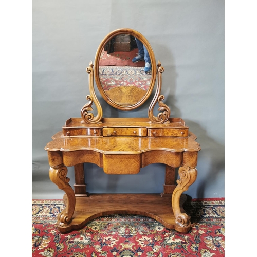 255A - Victorian walnut dressing table on cabriole legs and platform base {147 cm H x 124 cm W x 57 cm D}.
