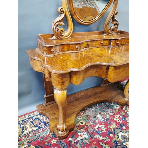 255A - Victorian walnut dressing table on cabriole legs and platform base {147 cm H x 124 cm W x 57 cm D}.