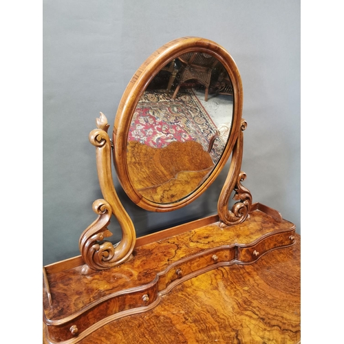 255A - Victorian walnut dressing table on cabriole legs and platform base {147 cm H x 124 cm W x 57 cm D}.