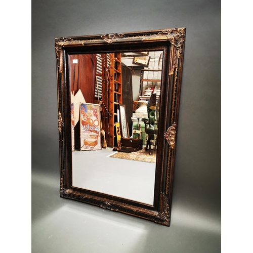 256 - Decorative gilt wall mirror {112 cm H x 81 cm W}.