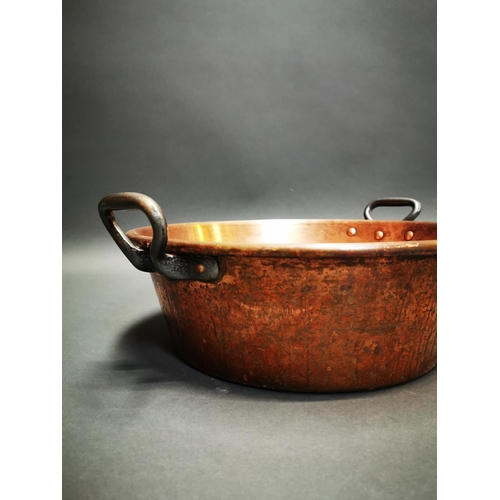 261 - Pair of early 20th C. hand beaten copper preserving pans with wrought iron handles {17 cm H x 47 cm ... 