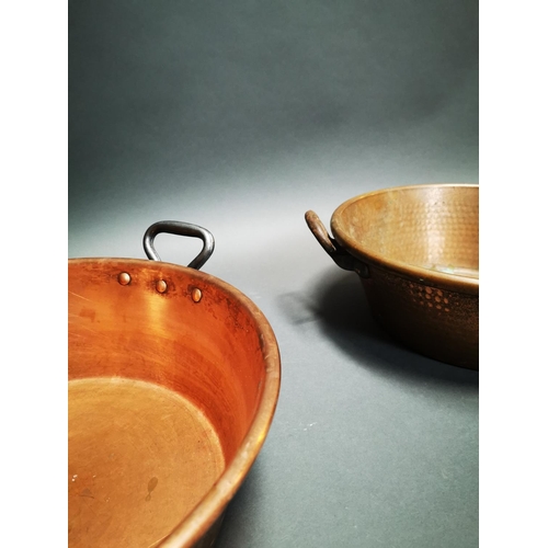 261 - Pair of early 20th C. hand beaten copper preserving pans with wrought iron handles {17 cm H x 47 cm ... 