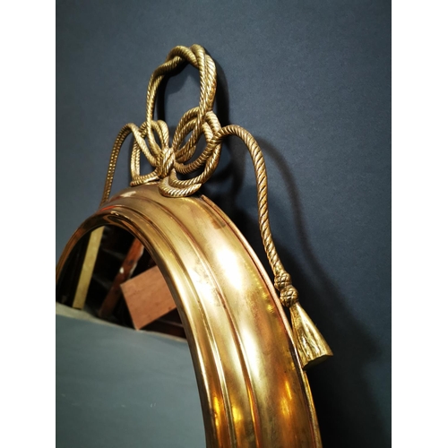 268 - Good quality brass framed wall mirror decorated with swags in the Regency style {80 cm H x 62 cm W}.