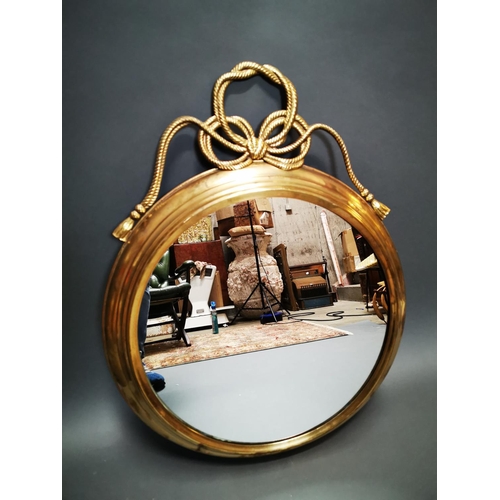 268 - Good quality brass framed wall mirror decorated with swags in the Regency style {80 cm H x 62 cm W}.