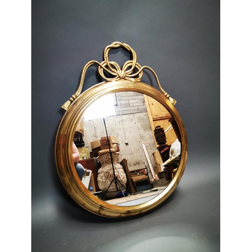 268 - Good quality brass framed wall mirror decorated with swags in the Regency style {80 cm H x 62 cm W}.