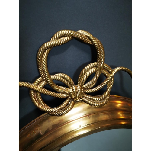 268 - Good quality brass framed wall mirror decorated with swags in the Regency style {80 cm H x 62 cm W}.