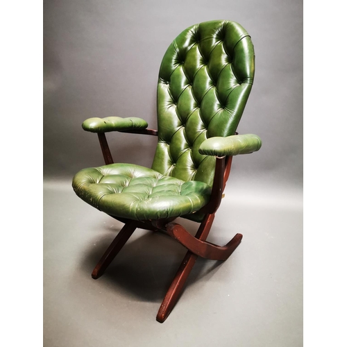 269 - Mahogany and leather deep buttoned campaign style folding chair {102 cm H x 67 cm W x 70 cm D}.