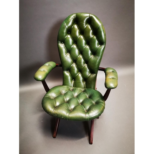 269 - Mahogany and leather deep buttoned campaign style folding chair {102 cm H x 67 cm W x 70 cm D}.