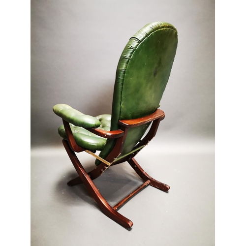 269 - Mahogany and leather deep buttoned campaign style folding chair {102 cm H x 67 cm W x 70 cm D}.