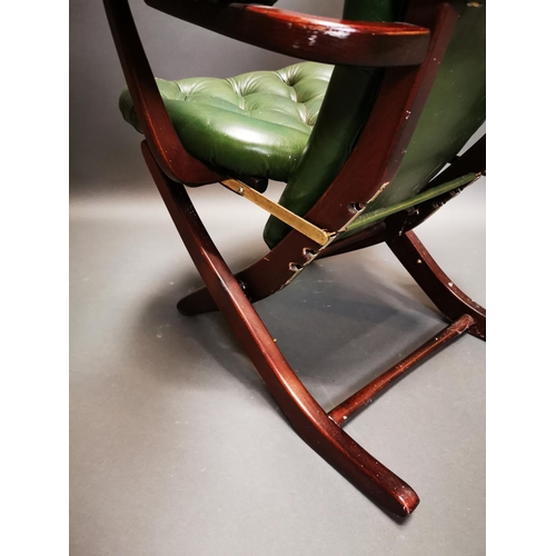 269 - Mahogany and leather deep buttoned campaign style folding chair {102 cm H x 67 cm W x 70 cm D}.