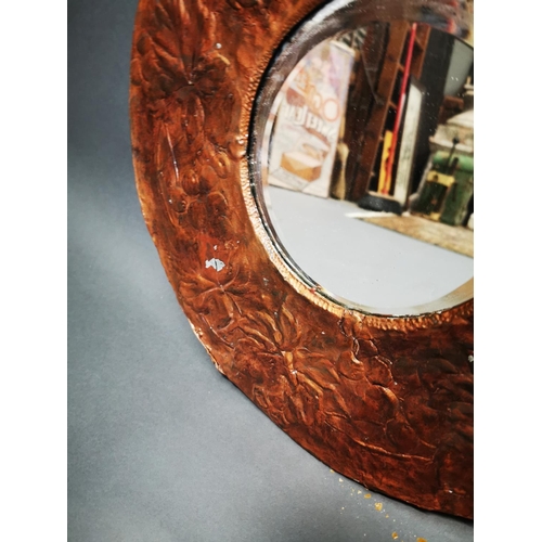 274 - Early 20th C. embossed wall mirror decorated with ivy leaf {45 cm Dia.}.