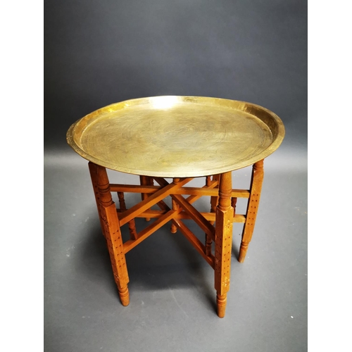 276 - Mid-century embossed brass folding table {47 cm H x 51 cm Dia.}.