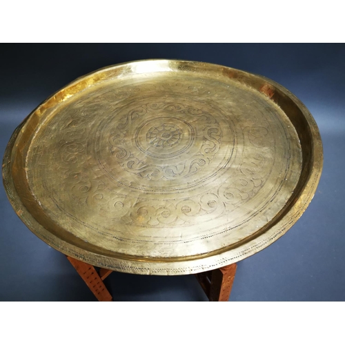 276 - Mid-century embossed brass folding table {47 cm H x 51 cm Dia.}.