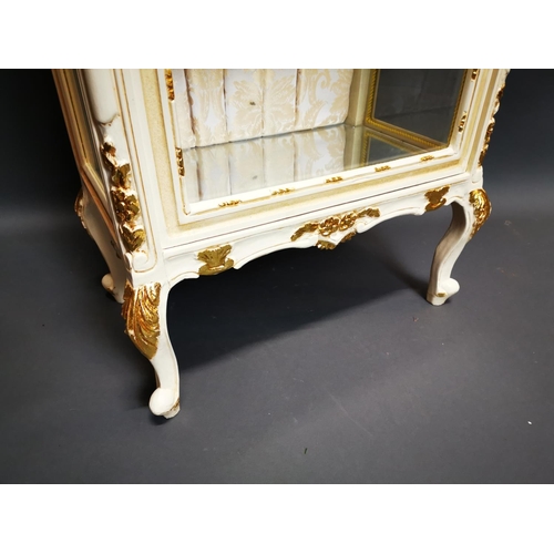 282 - Decorative painted and gilded wooden display cabinet on cabriole legs {202 cm H x 68 cm W x 42 cm D}... 