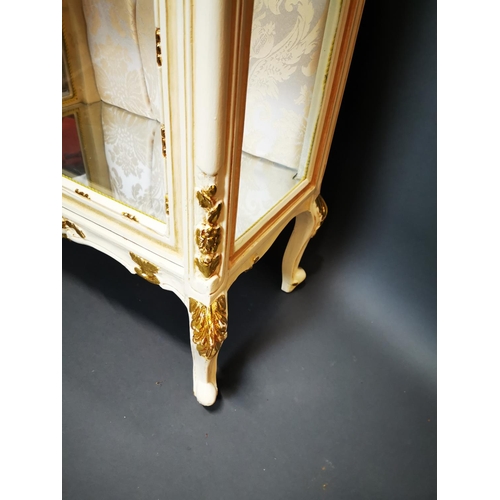 282 - Decorative painted and gilded wooden display cabinet on cabriole legs {202 cm H x 68 cm W x 42 cm D}... 