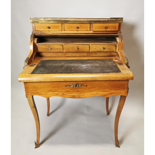295 - 19th C. inlaid satinwood ladies writing desk surmounted with brass mounts and fitted interior {109 c... 