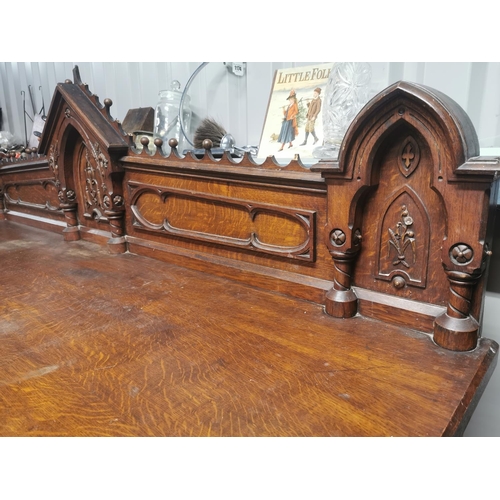 310A - Good quality Victorian carved oak side board in the Gothic style {150 cm H x 231 cm W x 73 cm D}.