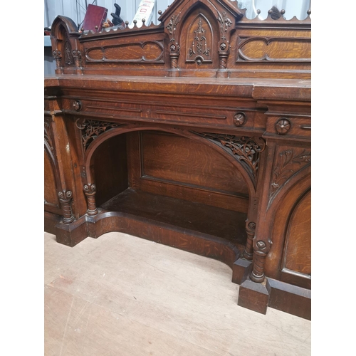 310A - Good quality Victorian carved oak side board in the Gothic style {150 cm H x 231 cm W x 73 cm D}.