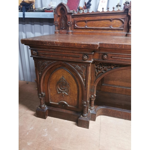 310A - Good quality Victorian carved oak side board in the Gothic style {150 cm H x 231 cm W x 73 cm D}.