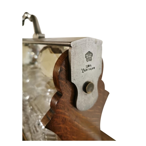 311 - Good quality 19th C. oak tantulus with three complete glass decanters {42 cm H x 33 cm W x 26 cm D}.