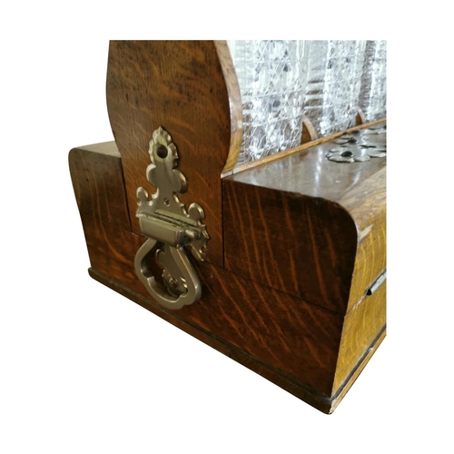 311 - Good quality 19th C. oak tantulus with three complete glass decanters {42 cm H x 33 cm W x 26 cm D}.