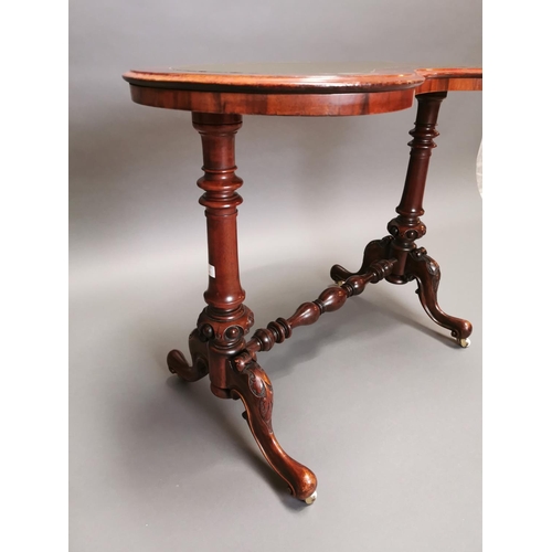 315 - 19th C. walnut and mahogany kidney shaped desk with inset leather top on carved supports and single ... 