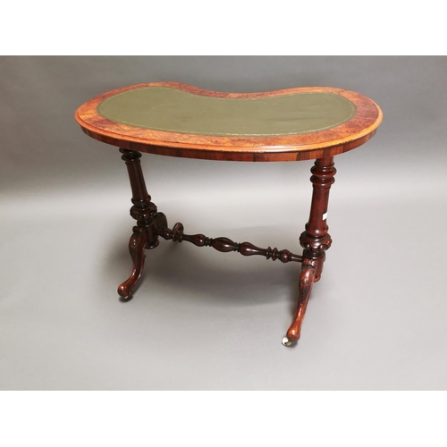 315 - 19th C. walnut and mahogany kidney shaped desk with inset leather top on carved supports and single ... 