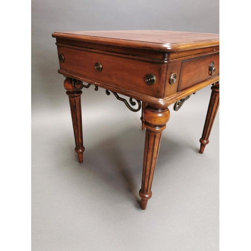 319 - Walnut lamp table with single drawer in the frieze on reeded legs {64 cm H x 66 cm W x 56 cm D}.