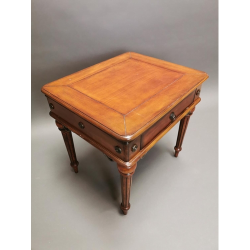 319 - Walnut lamp table with single drawer in the frieze on reeded legs {64 cm H x 66 cm W x 56 cm D}.