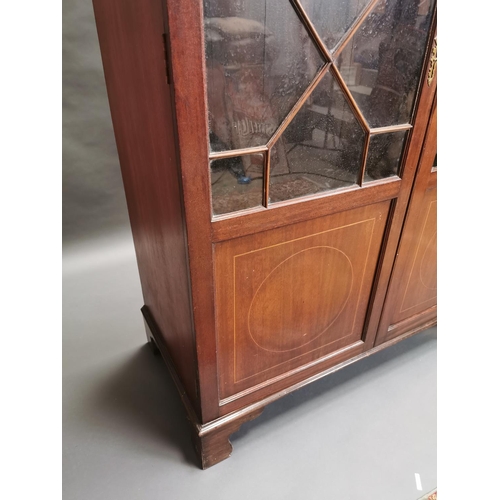 321 - Georgian inlaid mahogany book case with astral glazed doors {192 cm H x 121 cm W x 57 cm D}.