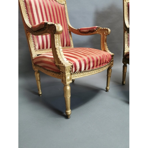 322 - Pair of carved giltwood and upholstered arm chairs in the French style {108 cm H x 56 cm W x 56 cm D... 