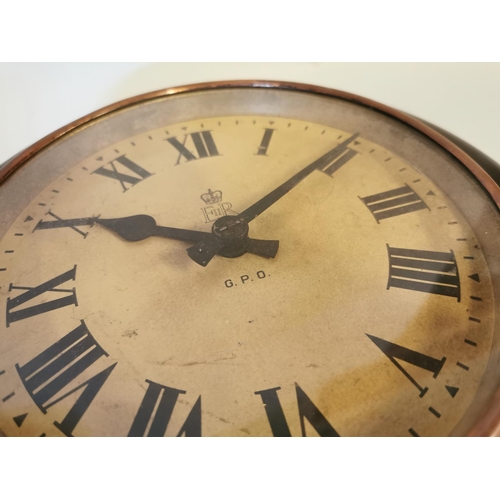 326 - Edwardian mahogany GPO wall clock with painted dial {29 cm Dia.}.
