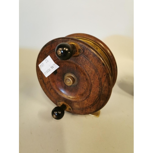 328 - Two early 20th C. mahogany and brass fishing reels.