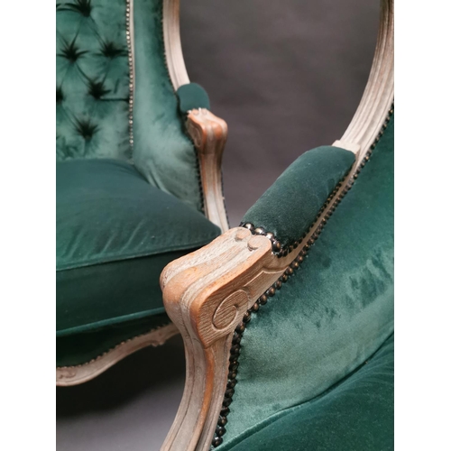 333 - Pair of early 20th C. bleached oak and crushed green velvet upholstered arm chairs in the French sty... 