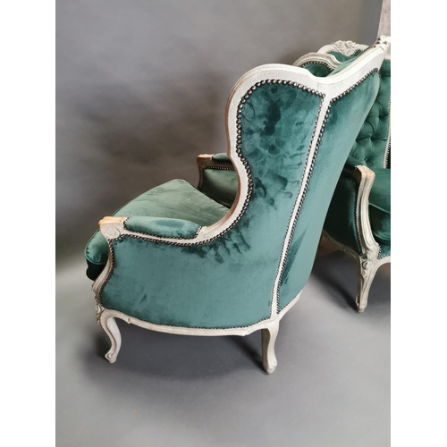 333 - Pair of early 20th C. bleached oak and crushed green velvet upholstered arm chairs in the French sty... 