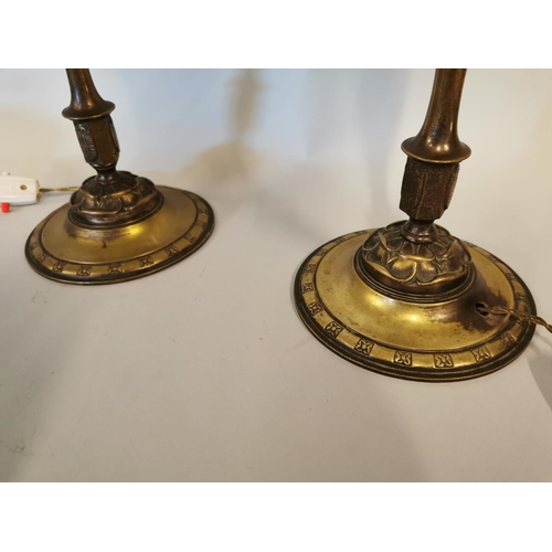 338 - Pair of Edwardian brass table lamps decorated with rosettes {38 cm H x 16 cm Dia.}.