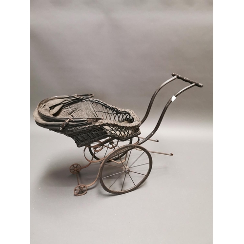 401 - 20th C. wrought iron and wicker dolls pram {70 cm H x 92 cm W x 36 cm D}.