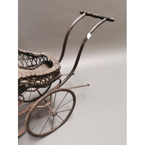 401 - 20th C. wrought iron and wicker dolls pram {70 cm H x 92 cm W x 36 cm D}.