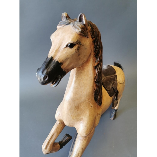 405 - Hand carved wooden child's horse {65 cm H x 56 cm W x 13 cm D}.