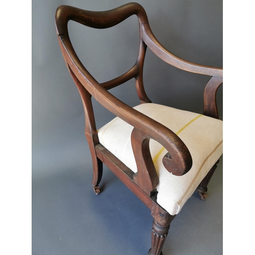 409 - Regency mahogany open arm chair on reeded legs {90 cm H x 54 cm W x 50 cm D}.
